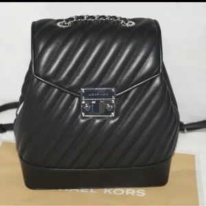 Micheal kors black and silver backpack